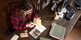 student reviewing historic photos for an internship