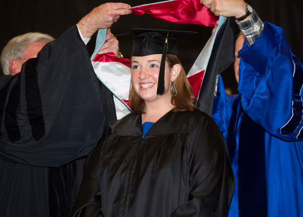 EDL graduate receives hood at Graduate Commencement