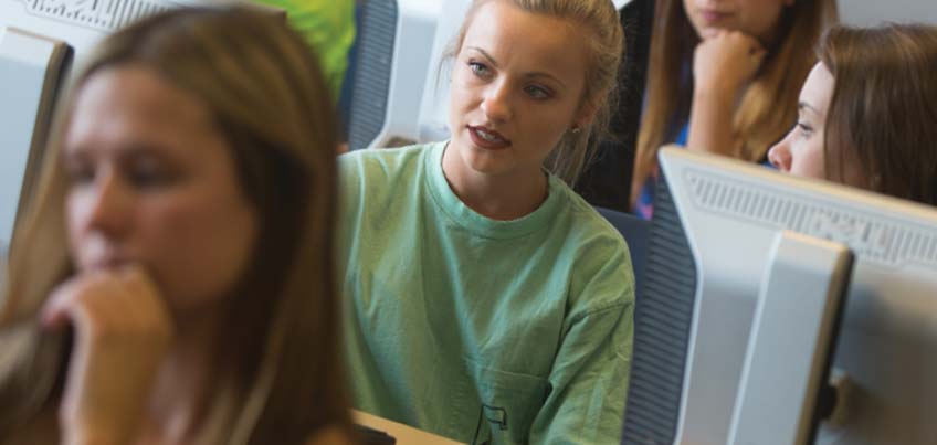 female students in CAP computer lab