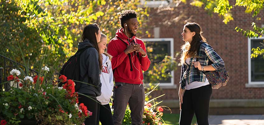 A group of students chatting outside