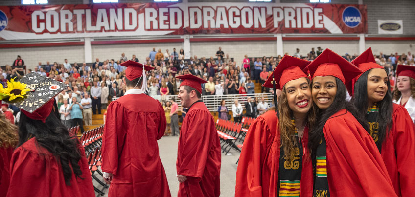 students pose for a commencement photo