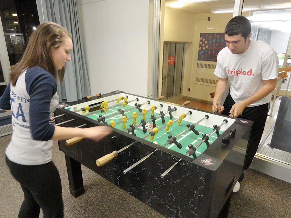 Students Playing Foosball