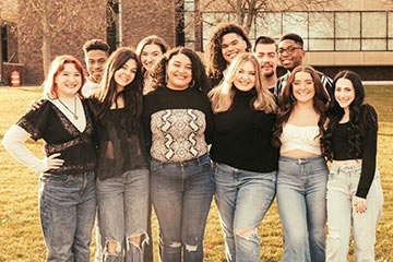 A group of students posing at a showcase