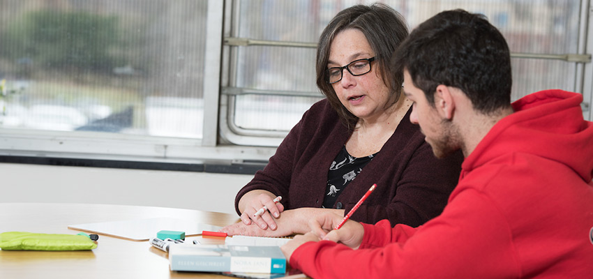 Esa Merson tutoring a student in The Learning Center