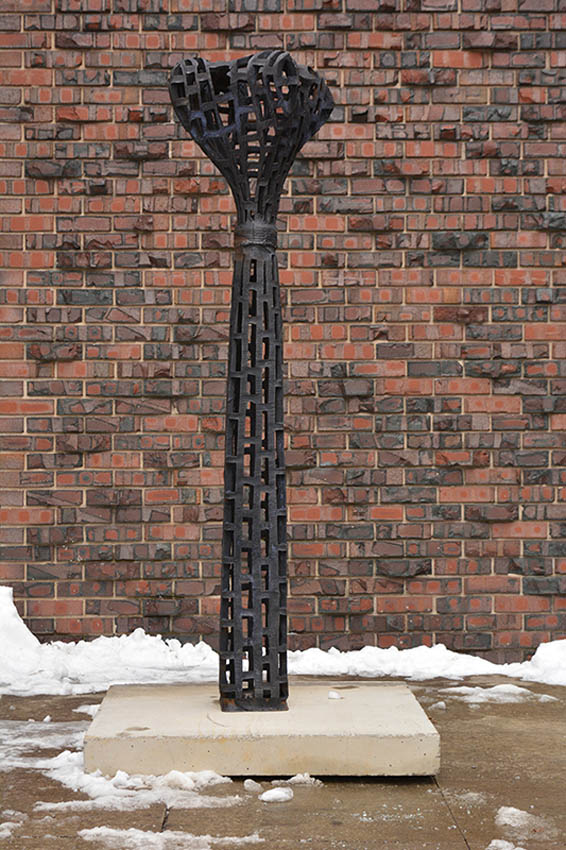 View of the outside of the Dowd Fine Arts Center, northwest entrance featuring cast iron sculpture by Vaughn Randall, professor of sculpture, Art and Art History Department.