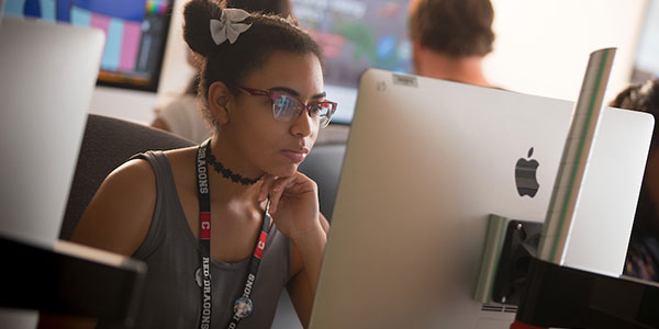 student working at a computer