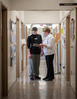 Nurse helping student